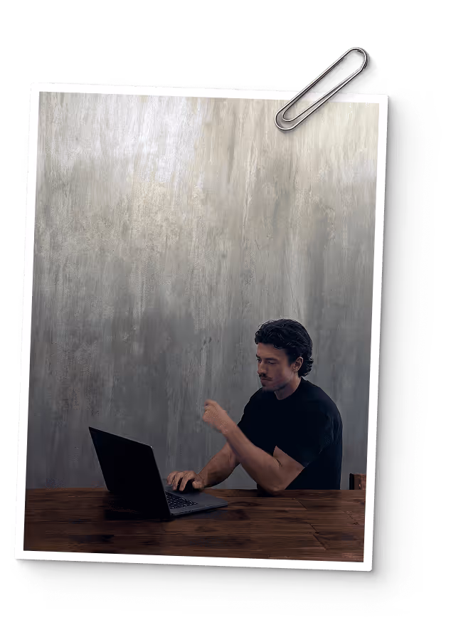 Polaroid photo of Bartek working on the playbook